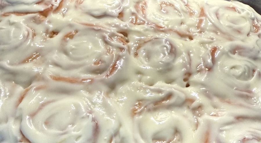 A pan of Ken and Tiana's frosted OG cinnamon rolls